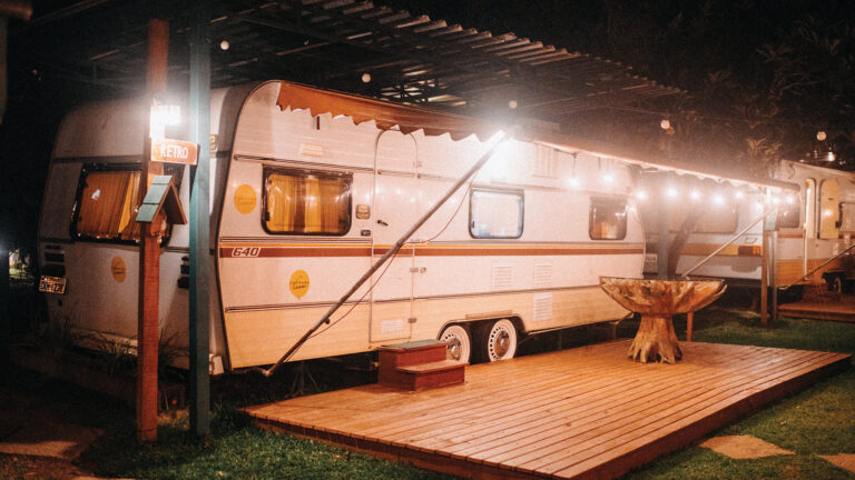 white camper van parked under roof