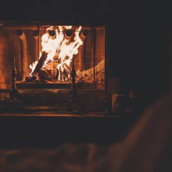 Burning fireplace with roaring fire