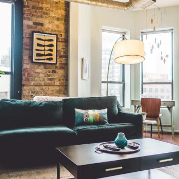 Green sofa in a brightly lit living room