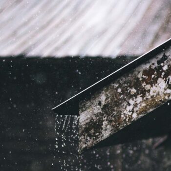 Corrugated Metal Sheet of House during Rainy Daytime