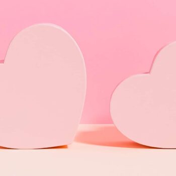 two hearts on a pink background