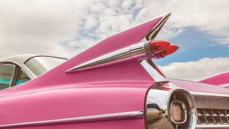 Pink vintage car on a sunny day.