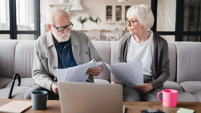 elderly couple going over bill payments