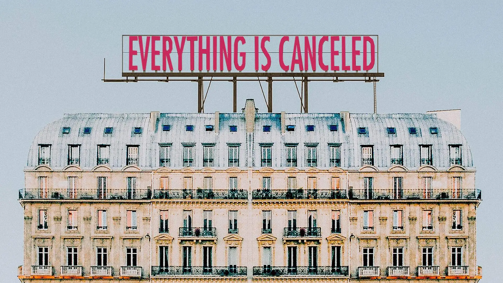 sign atop building saying that everything is canceled