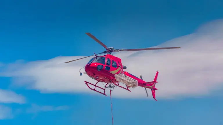 Fire fighting helicopter responding to wildfire.