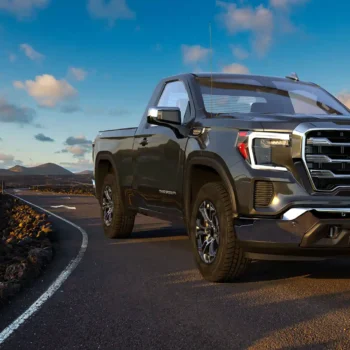 gmc sierra truck on roadway with blue skies in the background