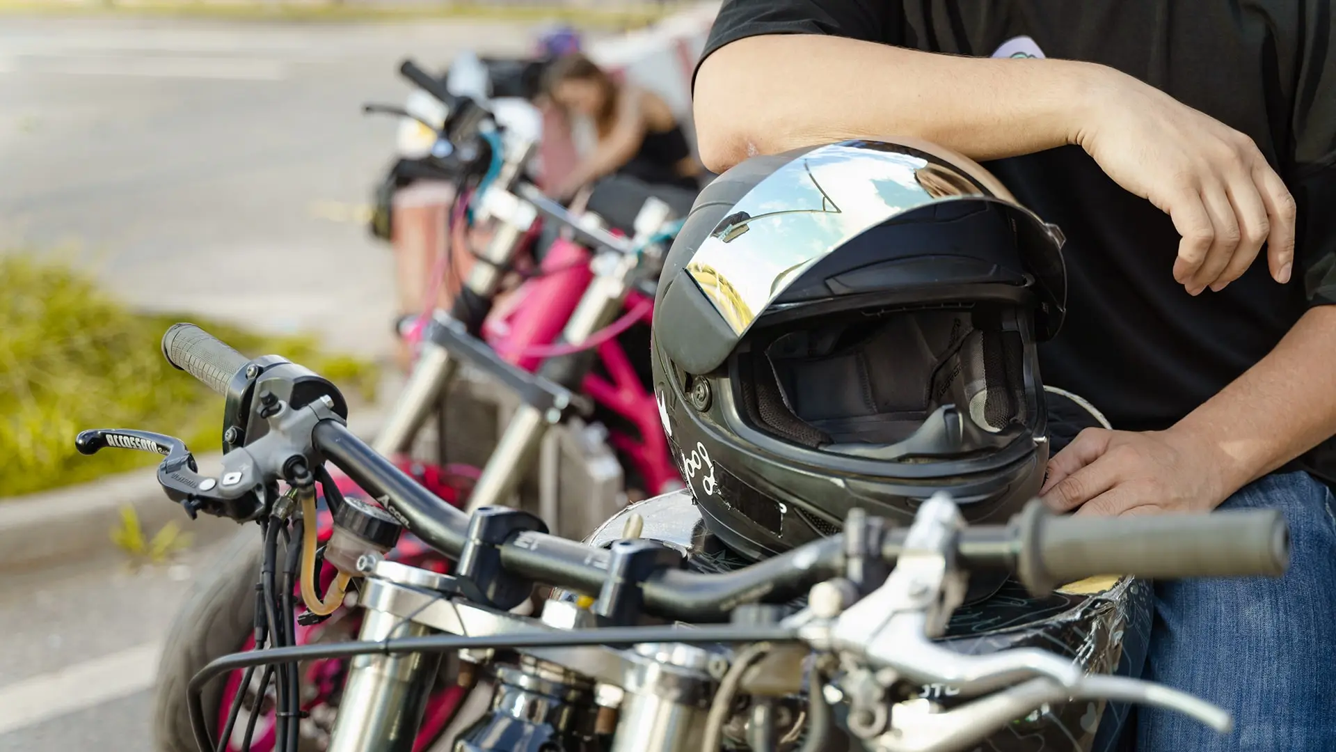 Rider leaning on his motorcycle