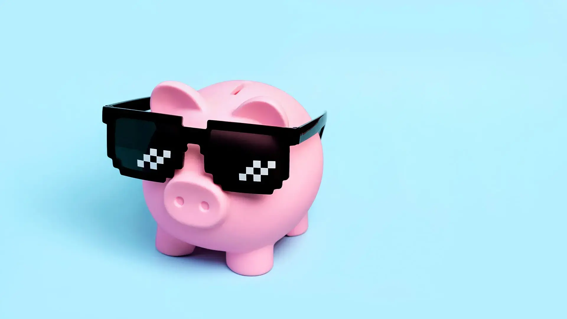 Pink ceramic piggy bank wearing pixel shades.