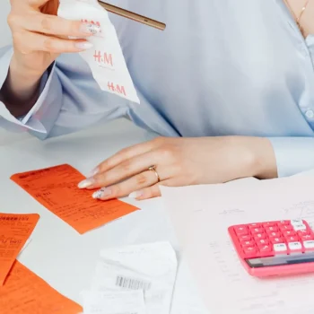 person organizing receipts and keeping details