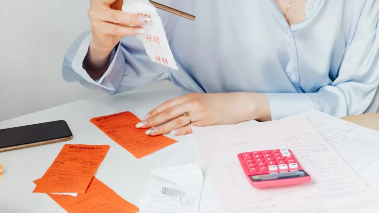 person organizing receipts and keeping details