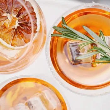 top view of three cocktails with garnishes