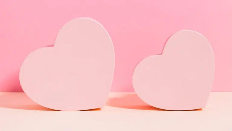 two hearts on a pink background