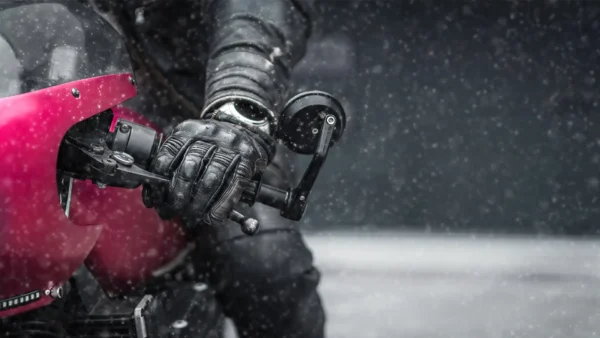 rider on motorcycle pressing the brakes in winter