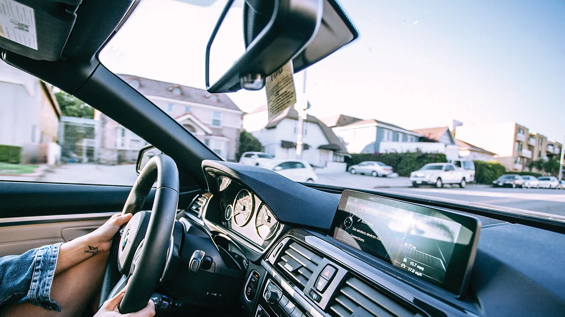 woman driving in car with hands on wheel