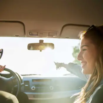 Young woman driving in a car.