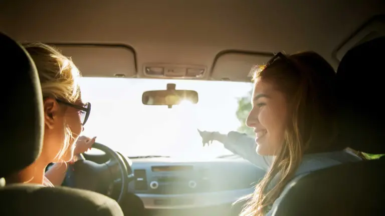 Young woman driving in a car.